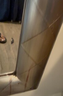 Blood stain around mirror.