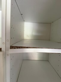 Damp, fusty cupboards with trim peeling