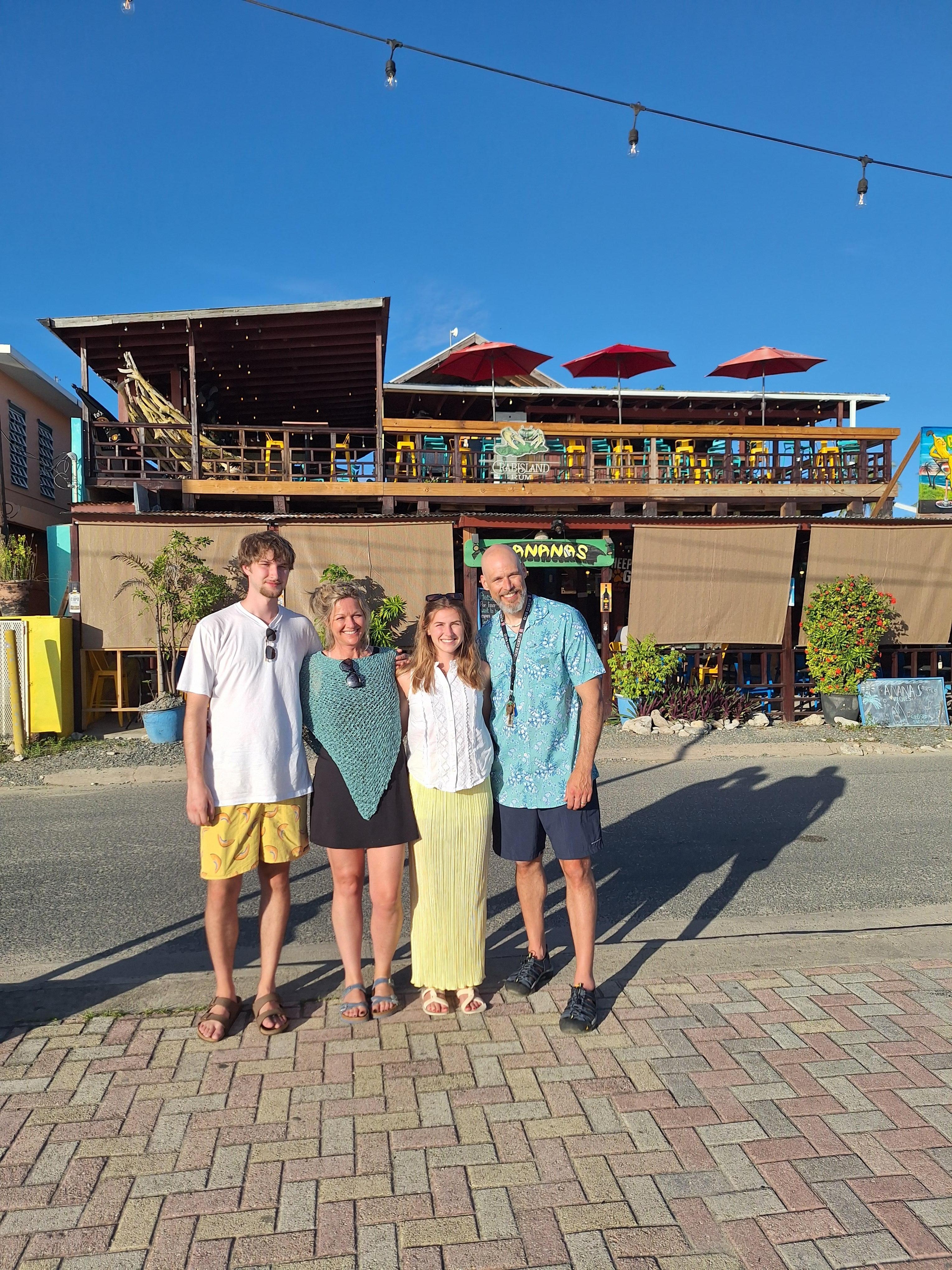 In front of restaurant,  rooms through restaurant. 