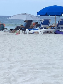 Beach chair bullies putting their chair right in front of rented chairs.