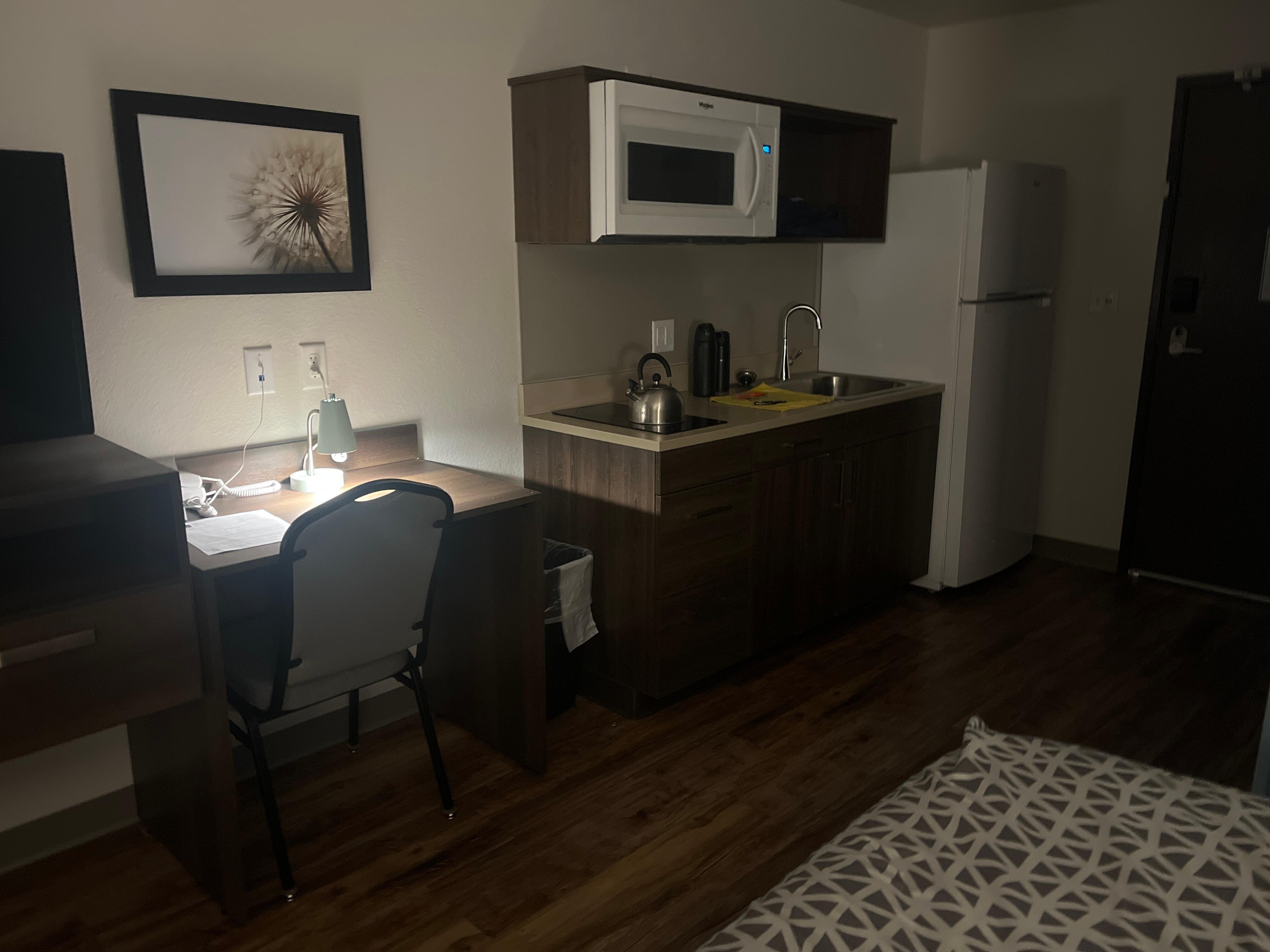 My typical stay at WoodSpring Suites. Bring your own small table lamp if overhead Florissant not your lighting mood.  