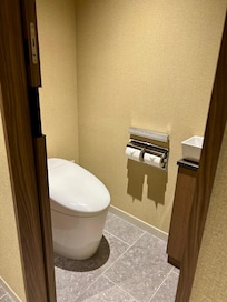 Separate toilet room with sink.
