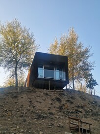Bungalow with balcony overlooking river and scenic views