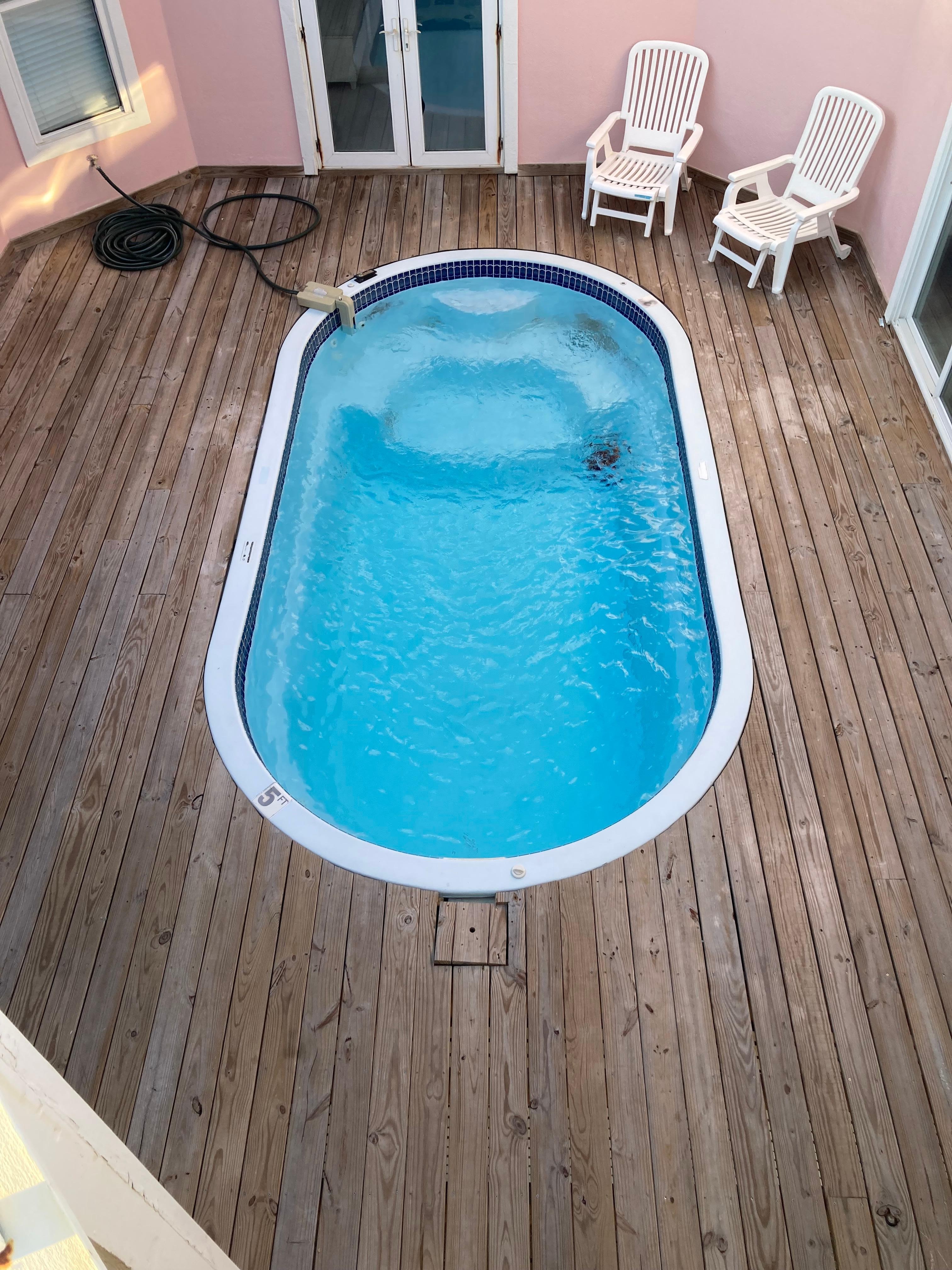 Looking down at pool from rooftop terrace 