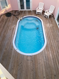 Looking down at pool from rooftop terrace