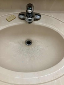 Bathroom sink cracked.