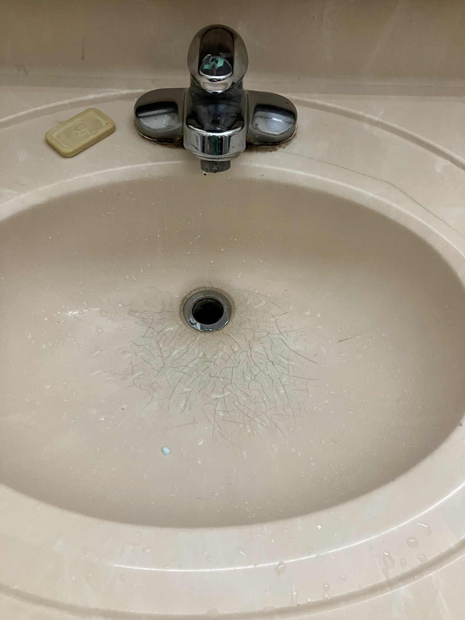 Bathroom sink cracked.