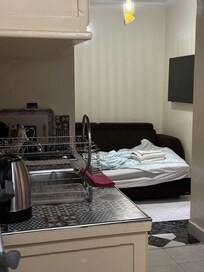 Take from the door to show size of apparent kitchen and “living room”