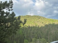 The view from the porch if you look beyond and above the 4-wheeler rental center