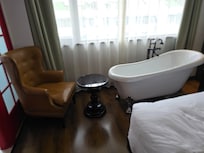 automatic open & close next to vintage bathtub