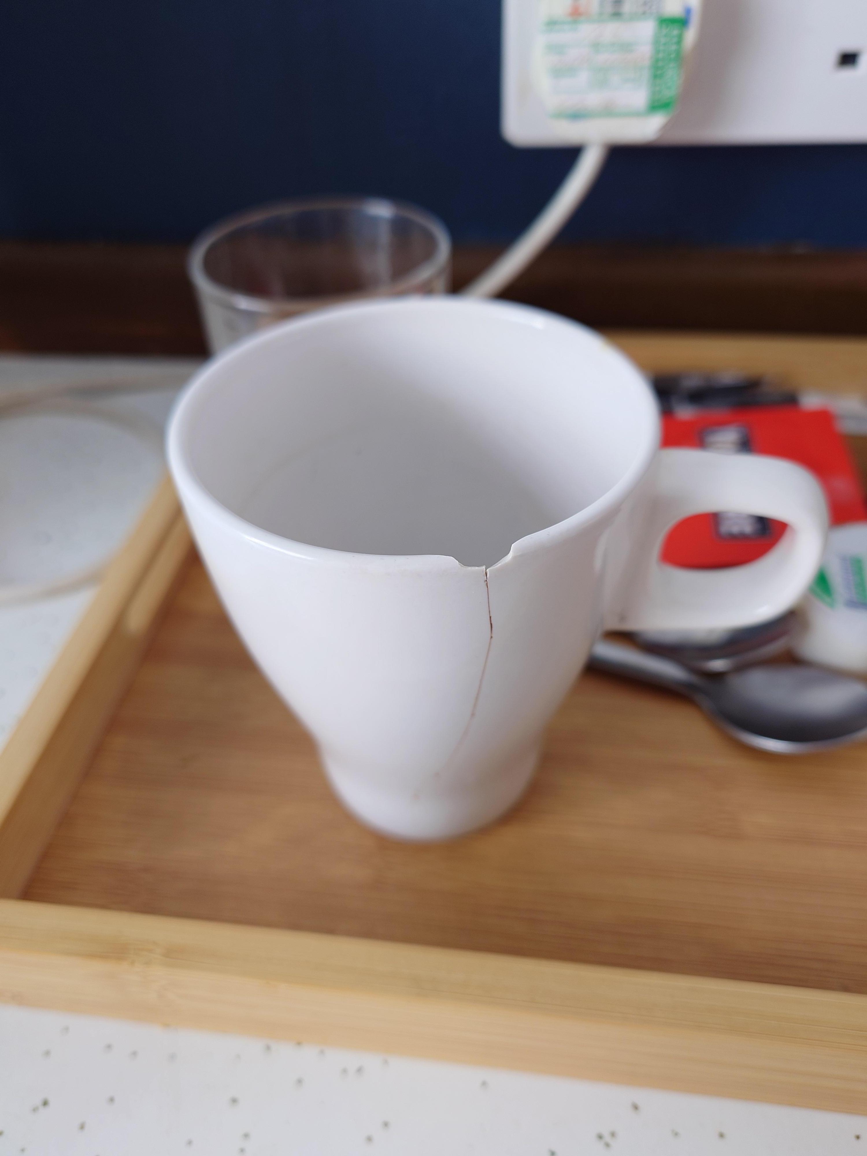 Chipped cup in room for tea and coffee
