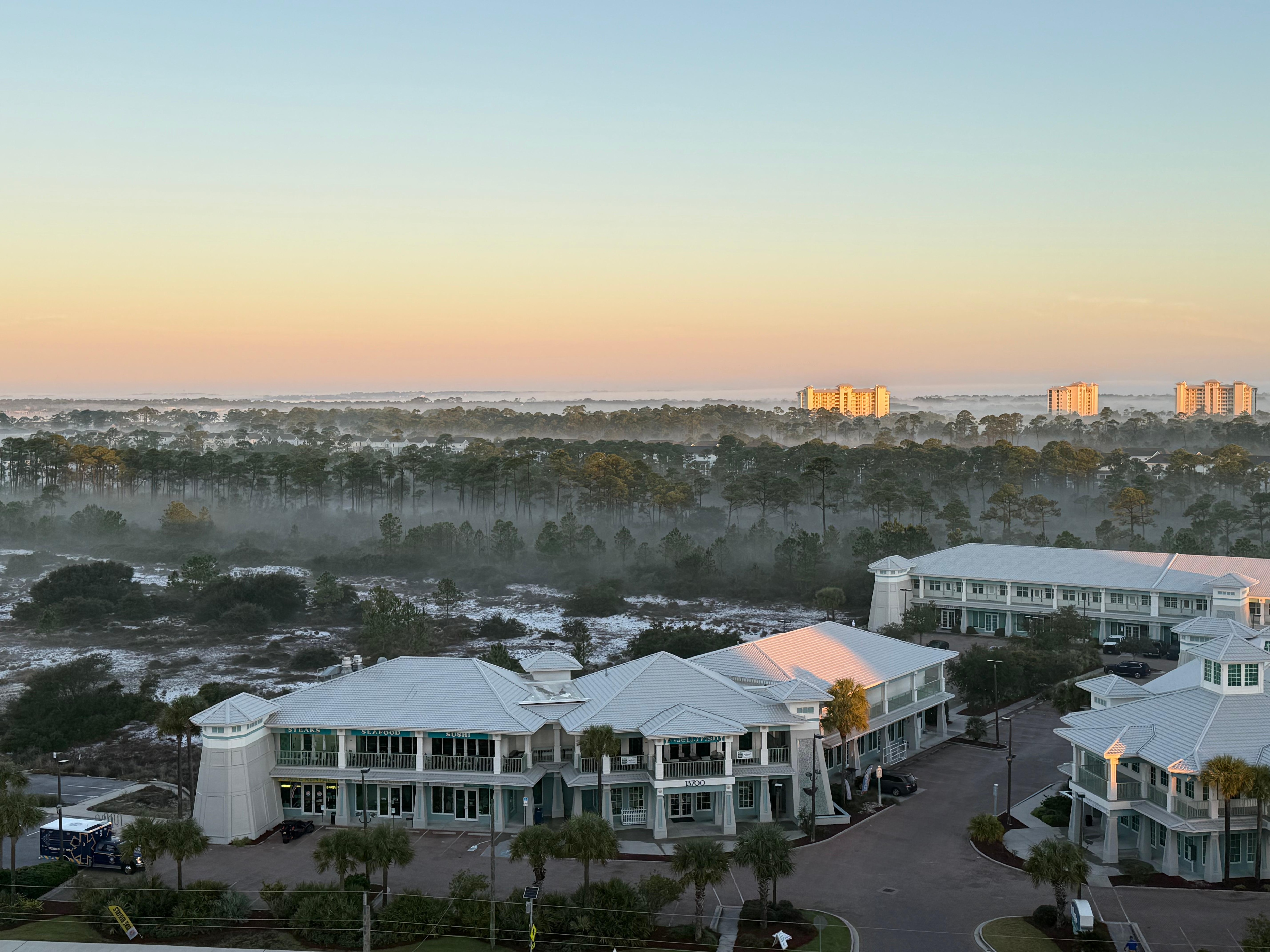 Complex across the street with 2 restaurants and several shops 