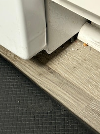 Food on floor by stove