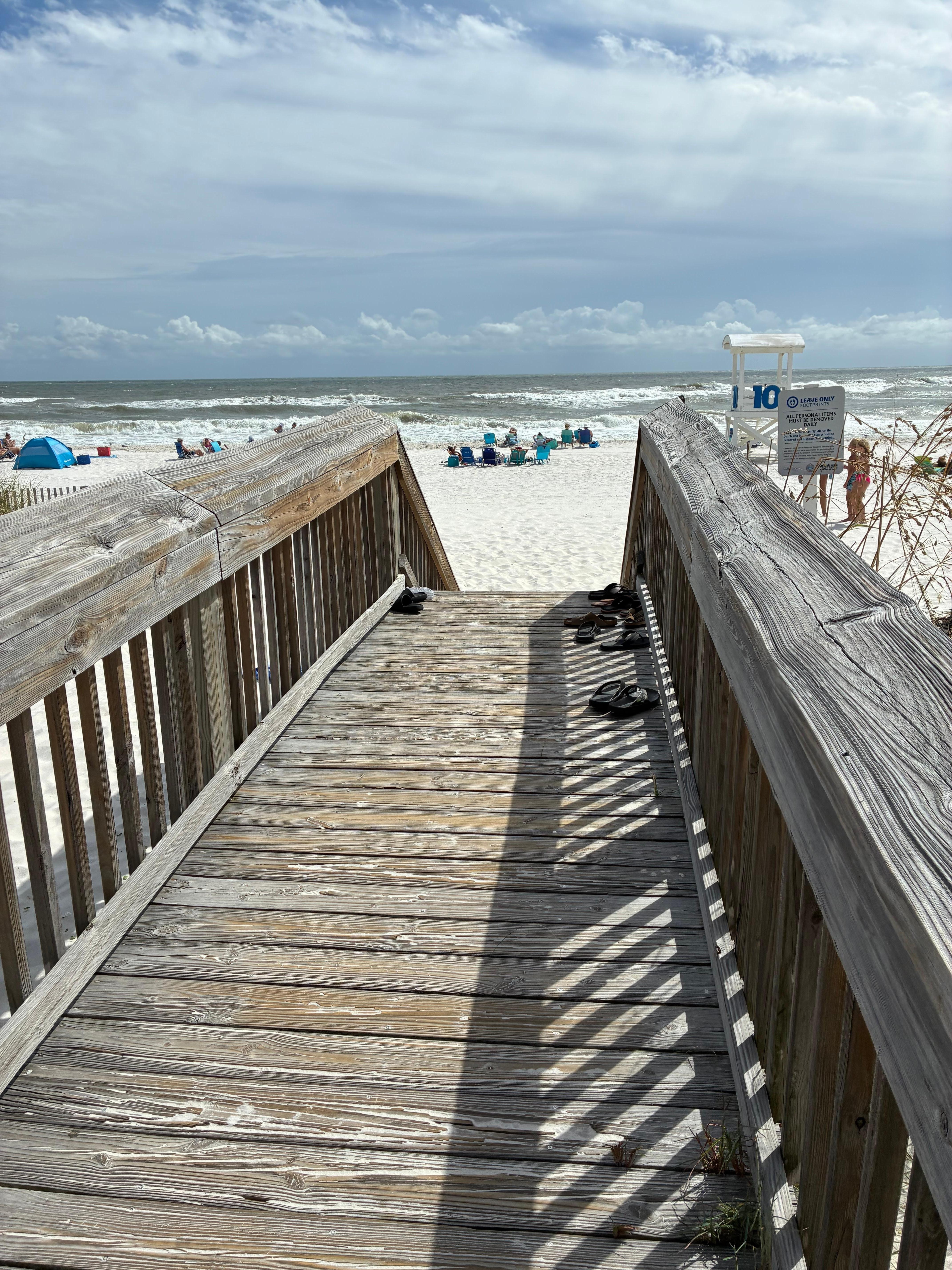 Walk to the beach and has a shower and bathroom at the entrance