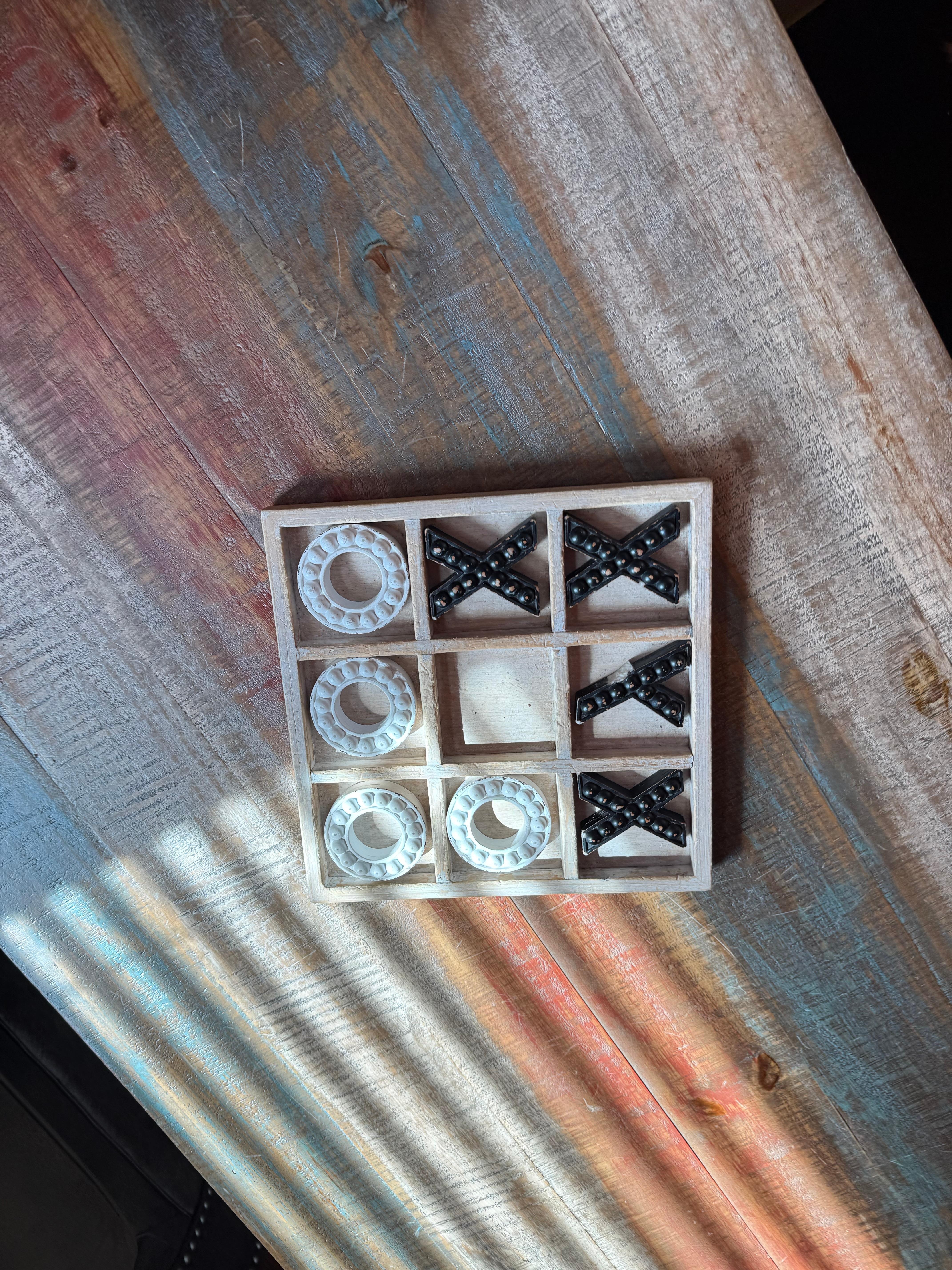 Broken Tic tac toe on table