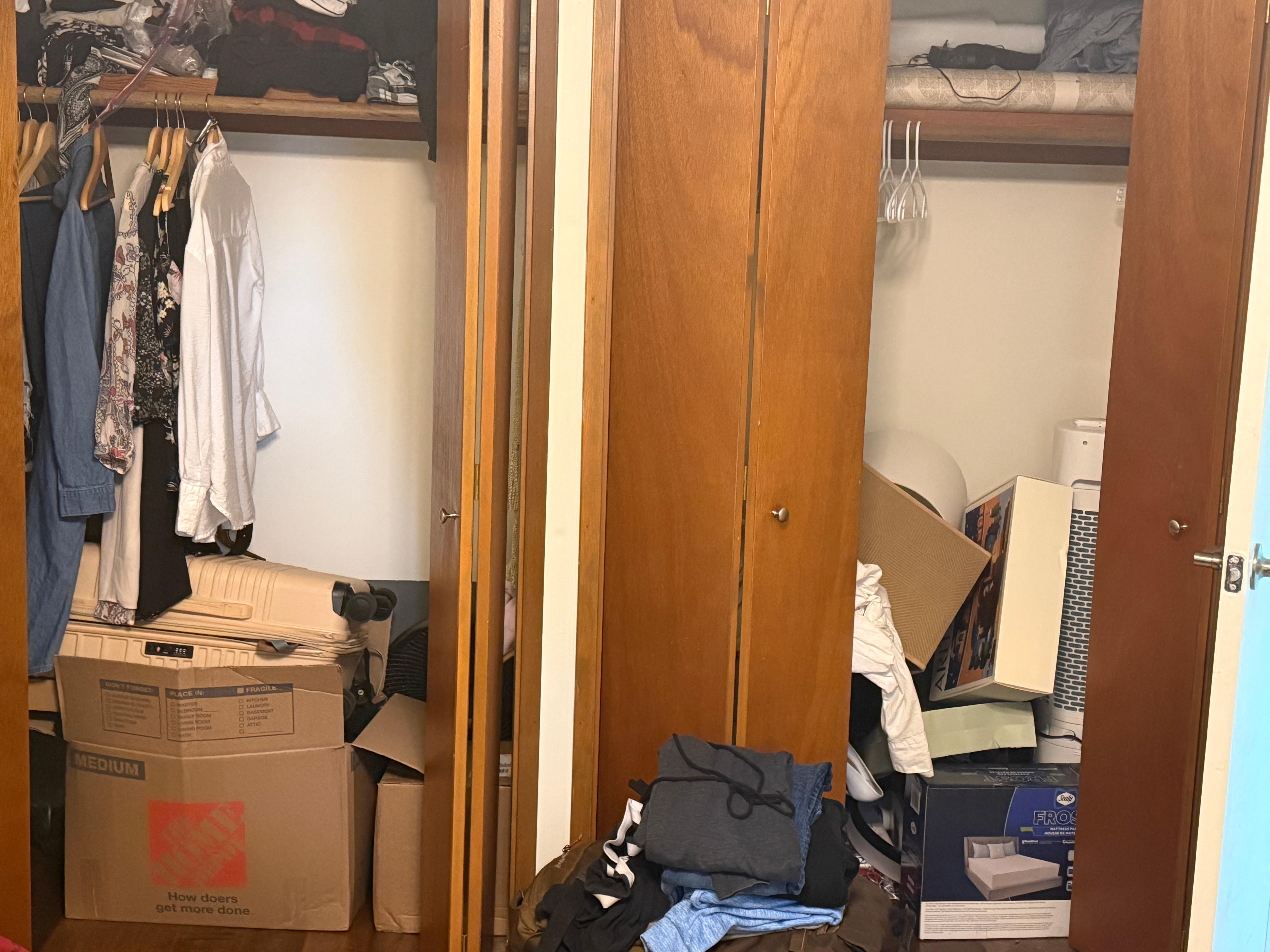 Bedroom closet full of owners items, lived out of suitcase 