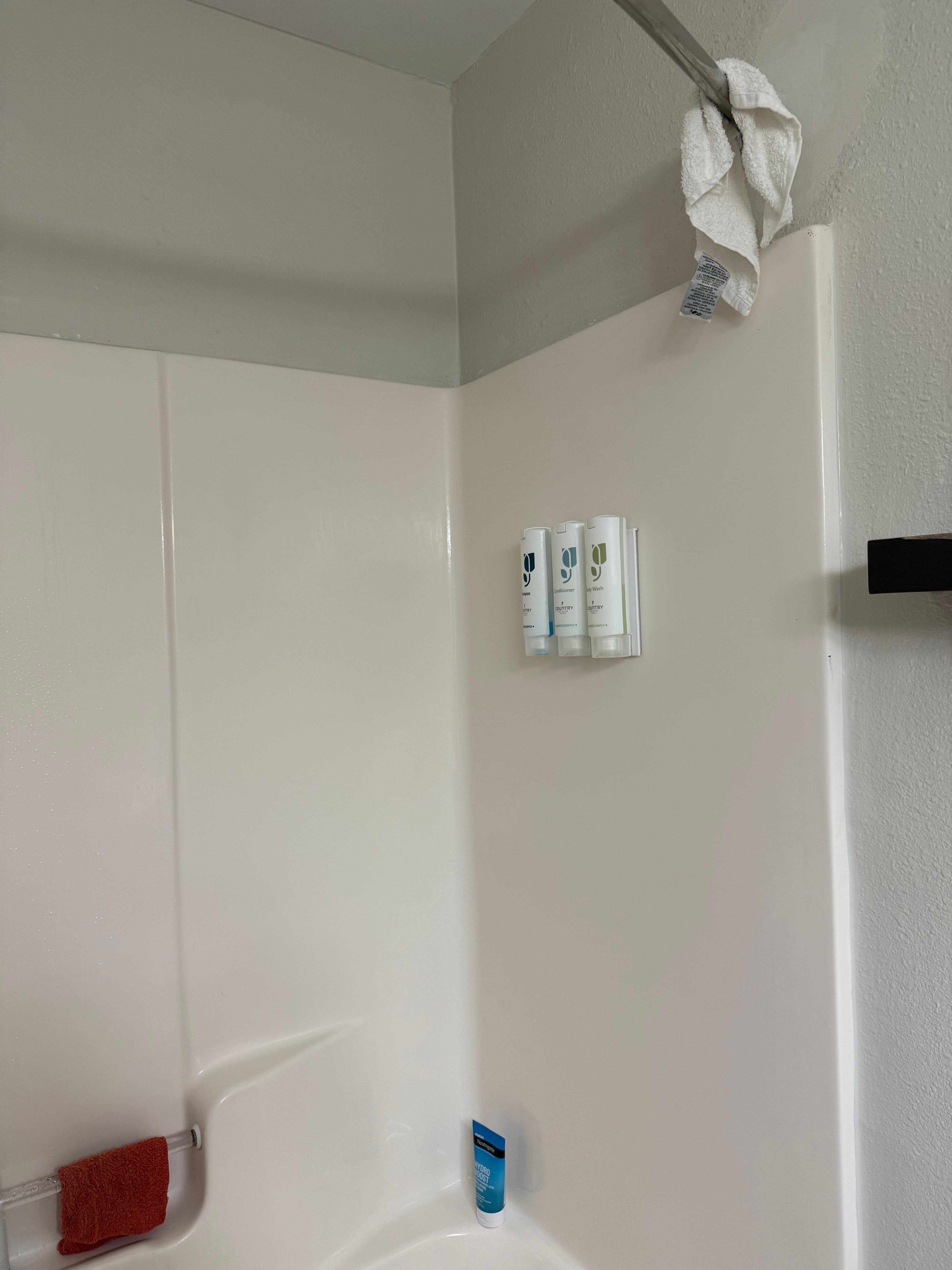 Towel from previous guest still hanging in the shower.