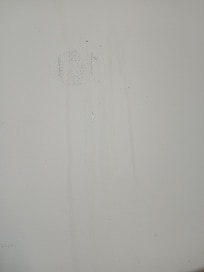 Possibly spit, about a foot above the head board