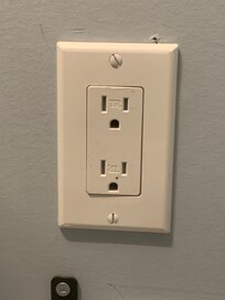 Bathroom receptacle not GFCI protected.