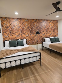 Lovely upstairs bedroom with full bath and by the game room.