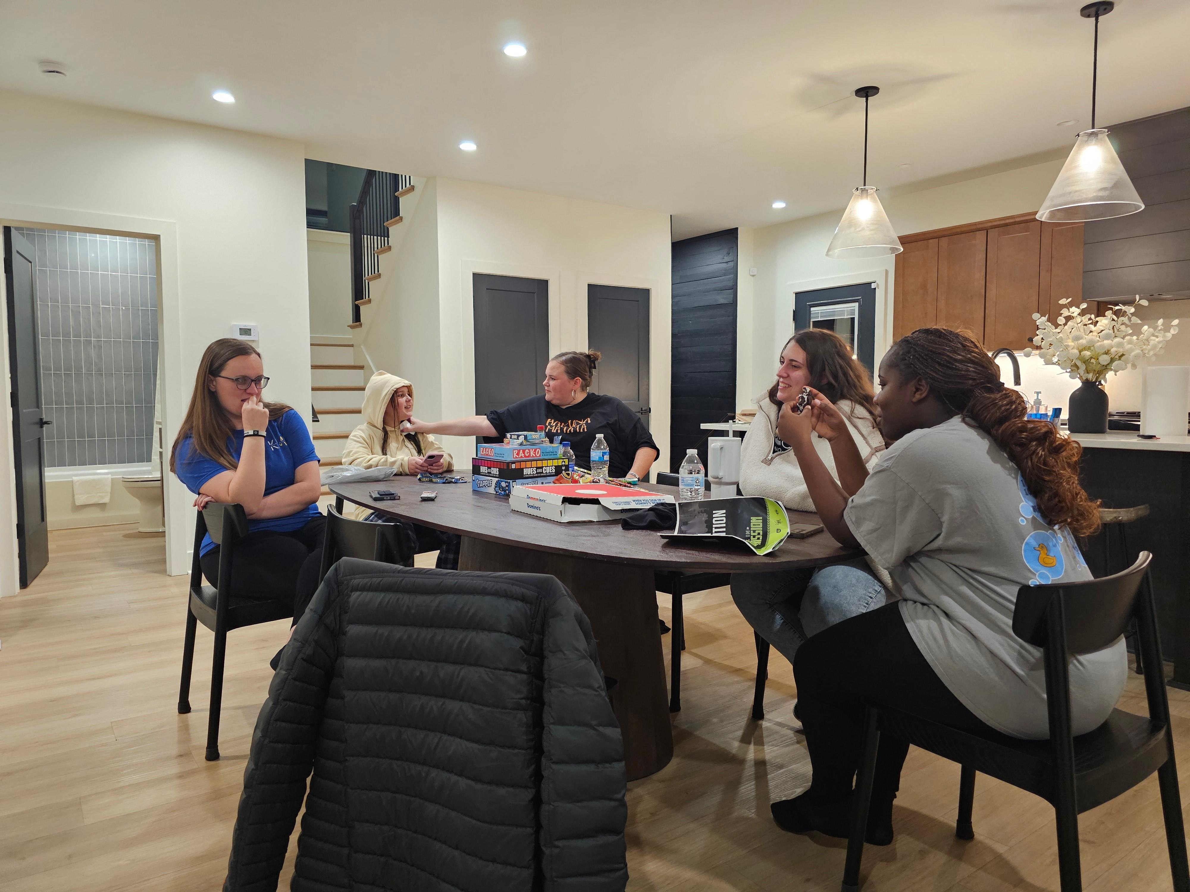 The team having fun at the kitchen table