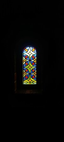 Beautiful stained glass windows bringing in light and colour.