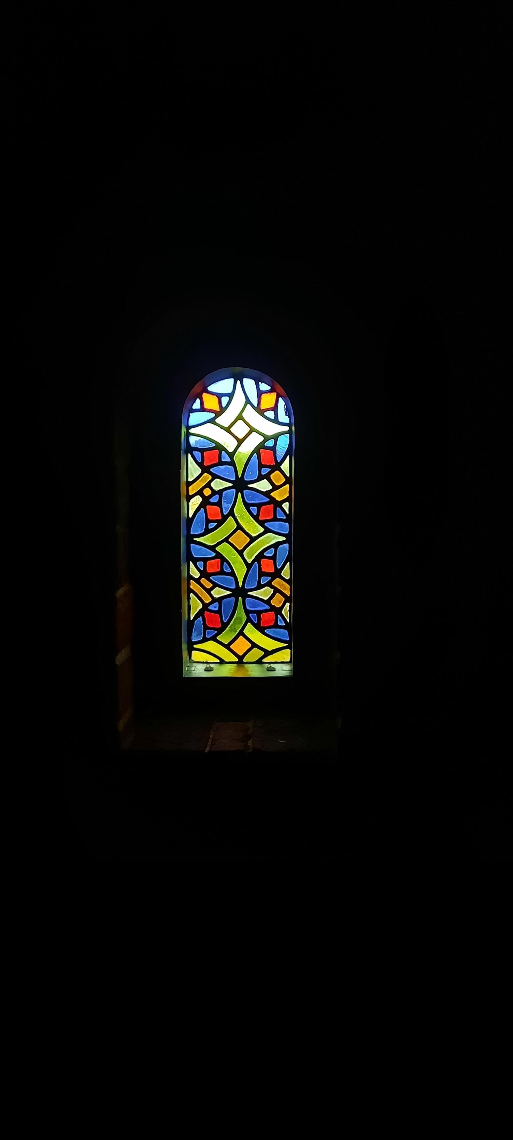 Beautiful stained glass windows bringing in light and colour.