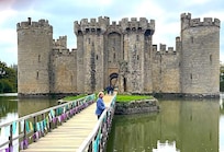 Crossing the moat at Bowdiam Castle, UK