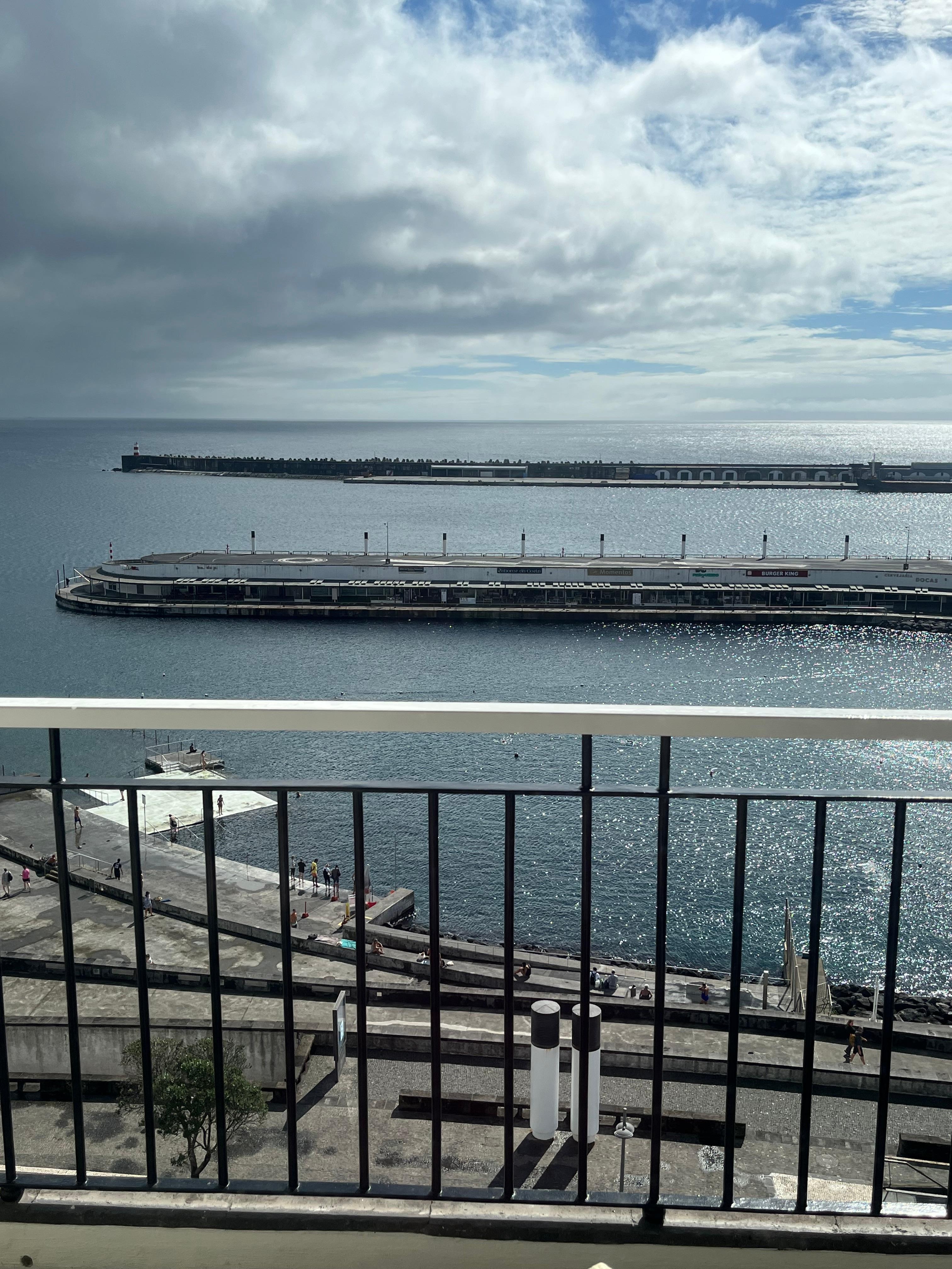 The port from our balcony with people swimming below