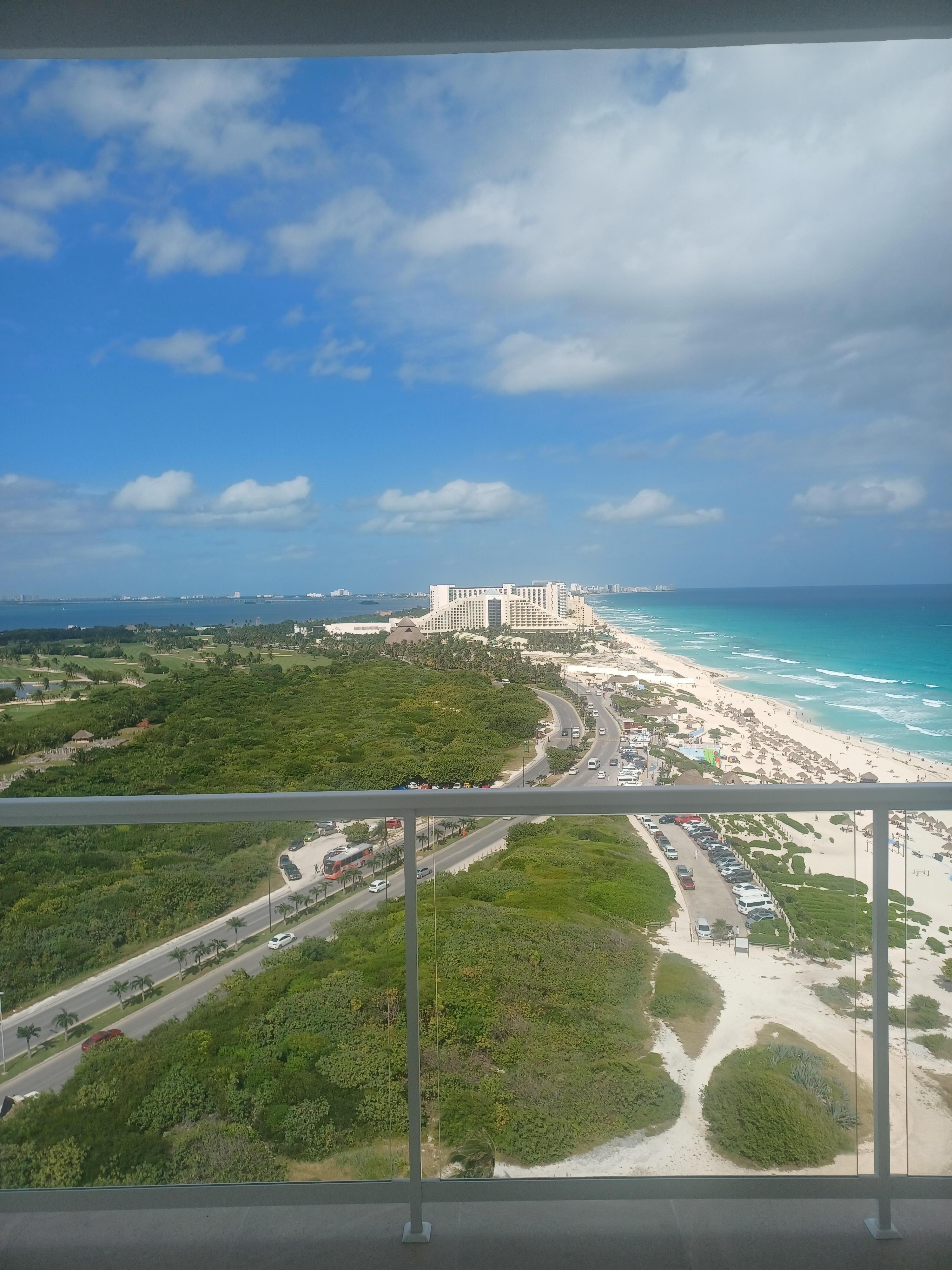 View from our 13th floor balcony. Public beach to the right. Lagoon on the left. Iberostar Resort straight ahead.