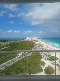 View from our 13th floor balcony. Public beach to the right. Lagoon on the left. Iberostar Resort straight ahead.