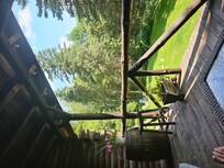 View from front porch. Fire pit and chairs on property... barbecue too