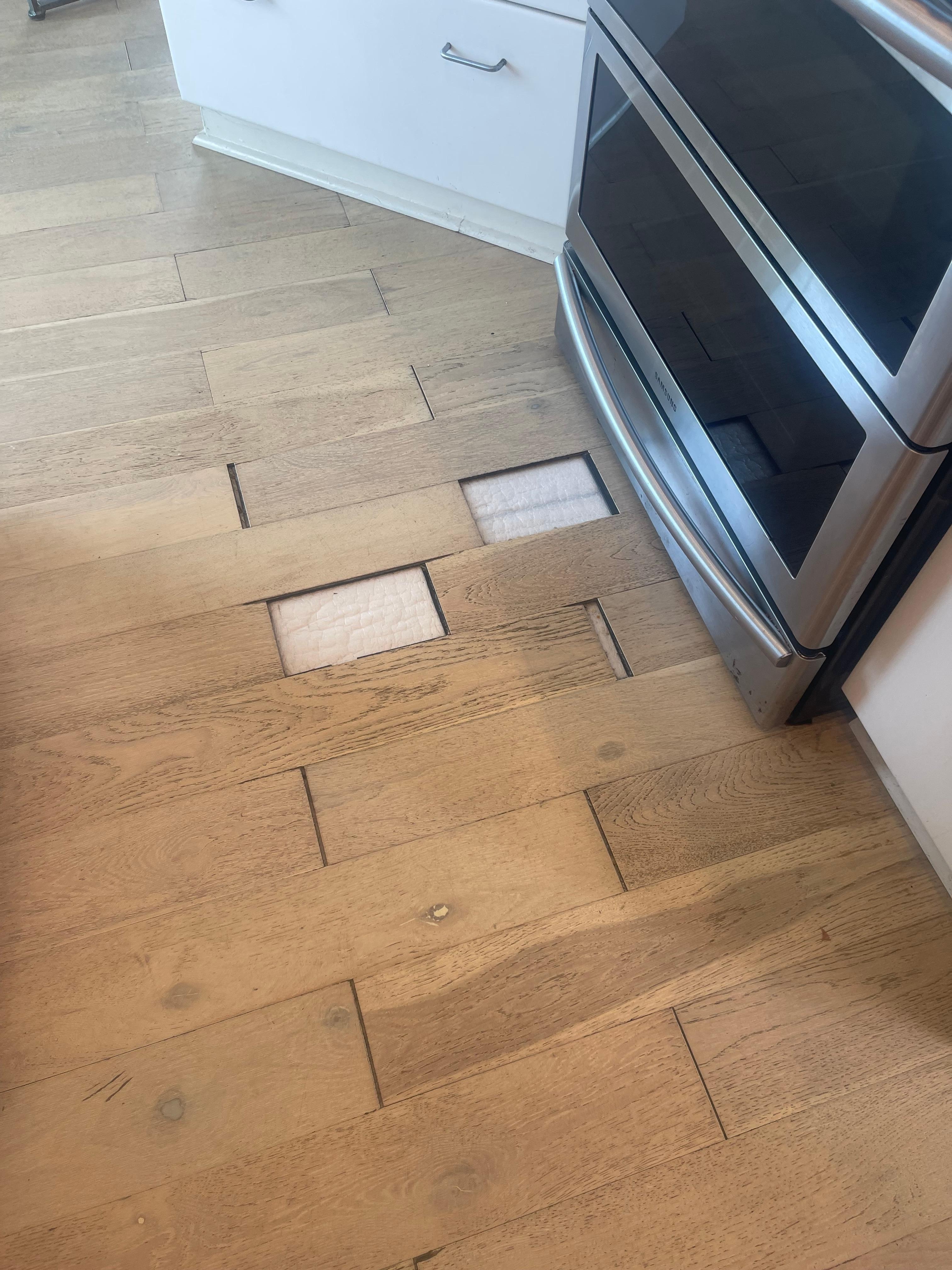 Missing floor in front of stove. 