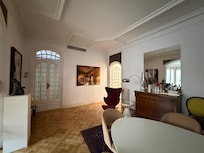 Dining room with entrance to kitchen on the right.