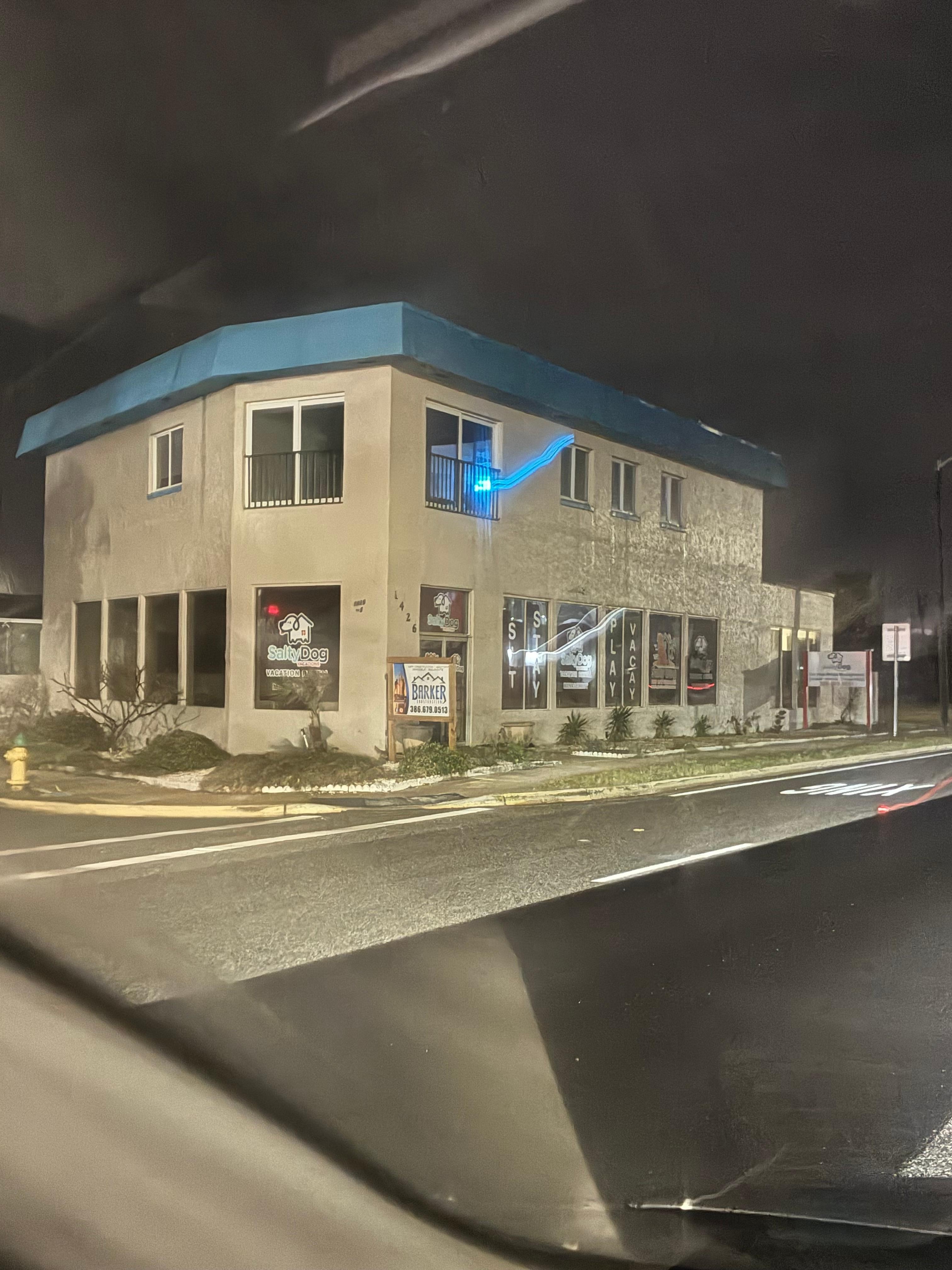 The unit is the top floor of this office building. 