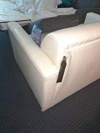 Torn couch with duct tape