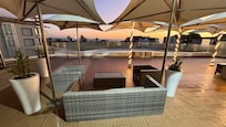 Sunrise view of ocean across pool deck view 2