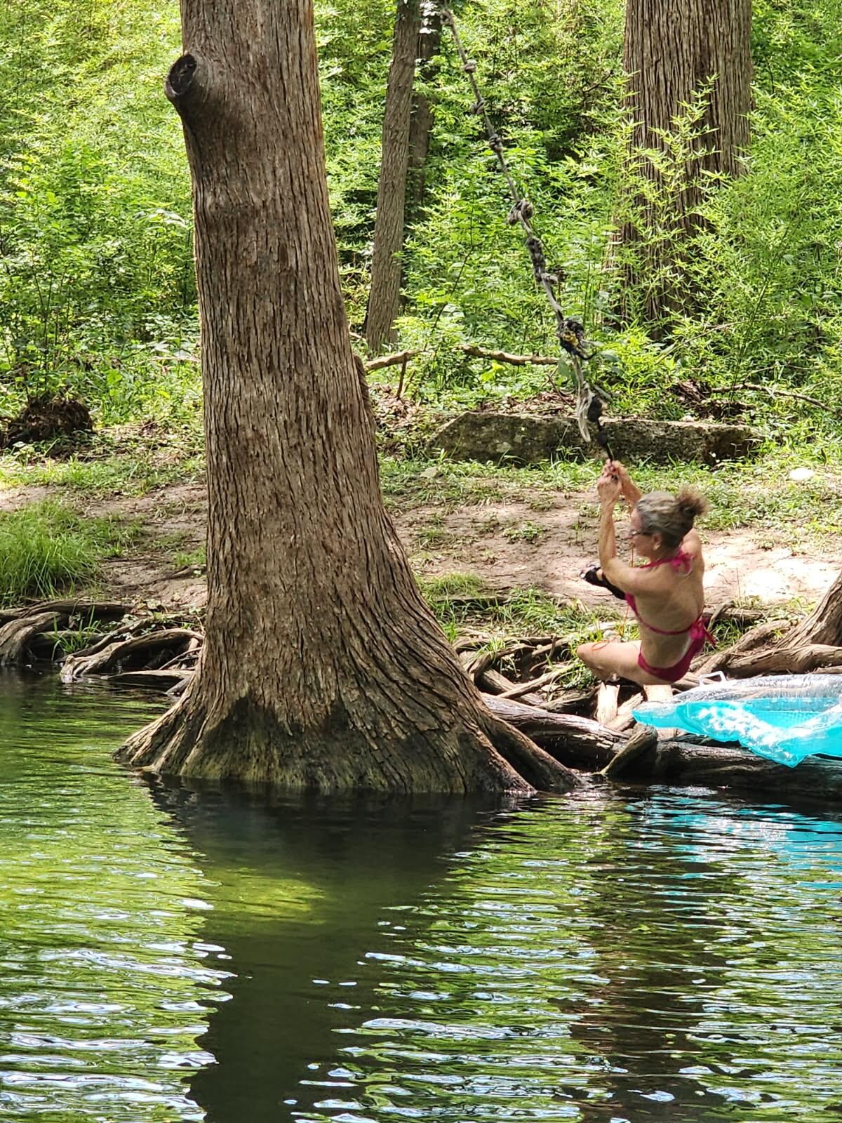 On a rope swing close by. 