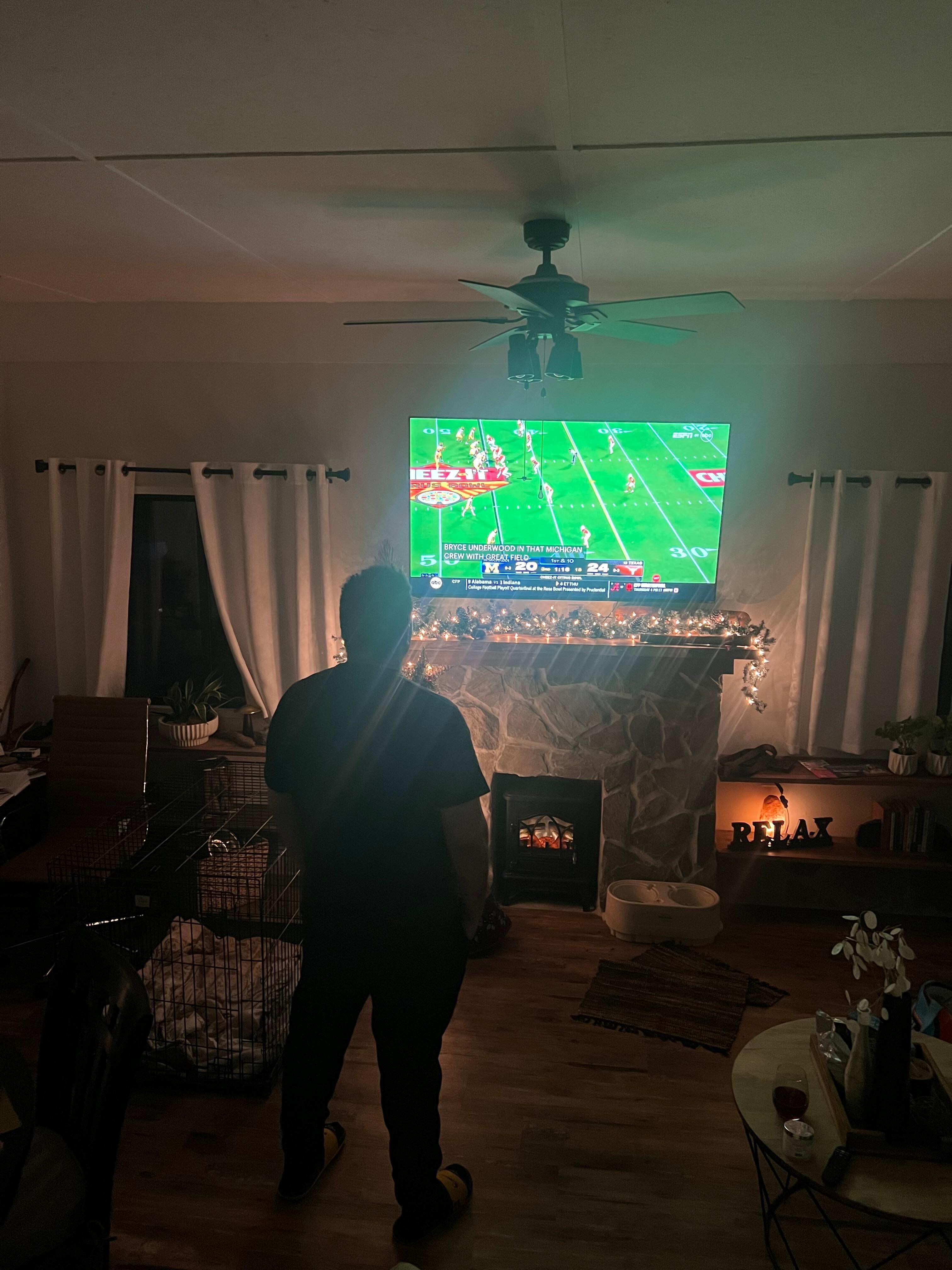 My husband watching his fav team 