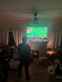 My husband watching his fav team