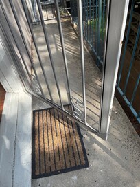 Screen coming off door. Downstairs neighbor knocked and told us not to use shower as water dripped directly into his lounge room.