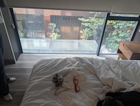 Outdoor seating for bar directly beneath bed