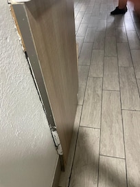 Closet door falling from the wall