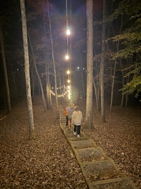 The lights add some magic on the walk to the fire pit and riverfront!