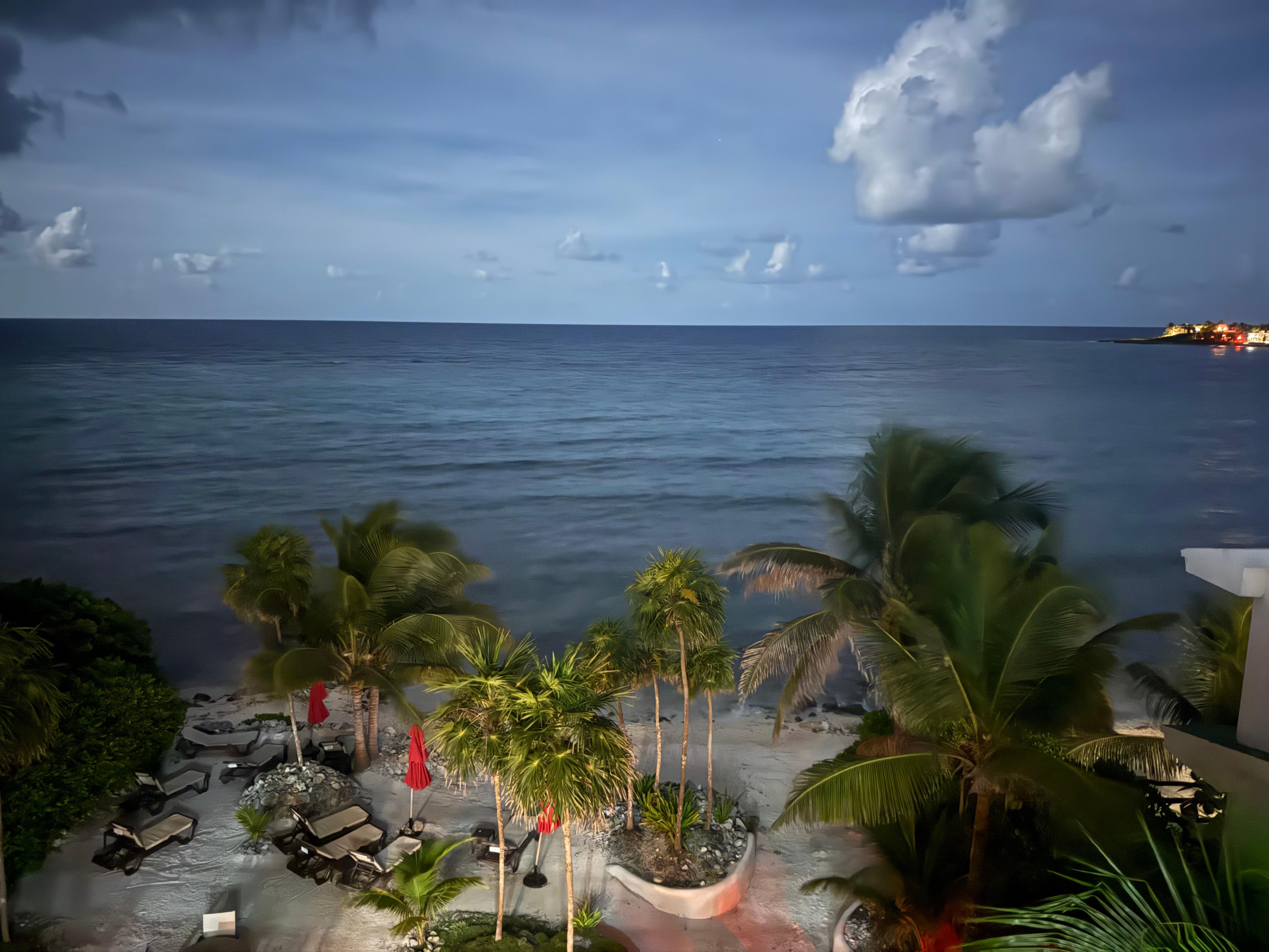 Looking down from the condo balcony at night 