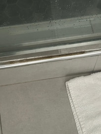 Shower had yellow gunk.