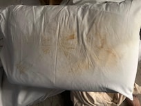 Bottom of two pillows. One side clean this was the other side.
