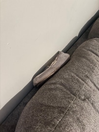 Found a shoe resting on the back of the couch. Is a cleaning person really coming to clean this property? I doubt it.