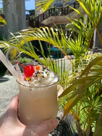 Drink by the very large and well laid out pool. There are many little areas that you can set yourself in