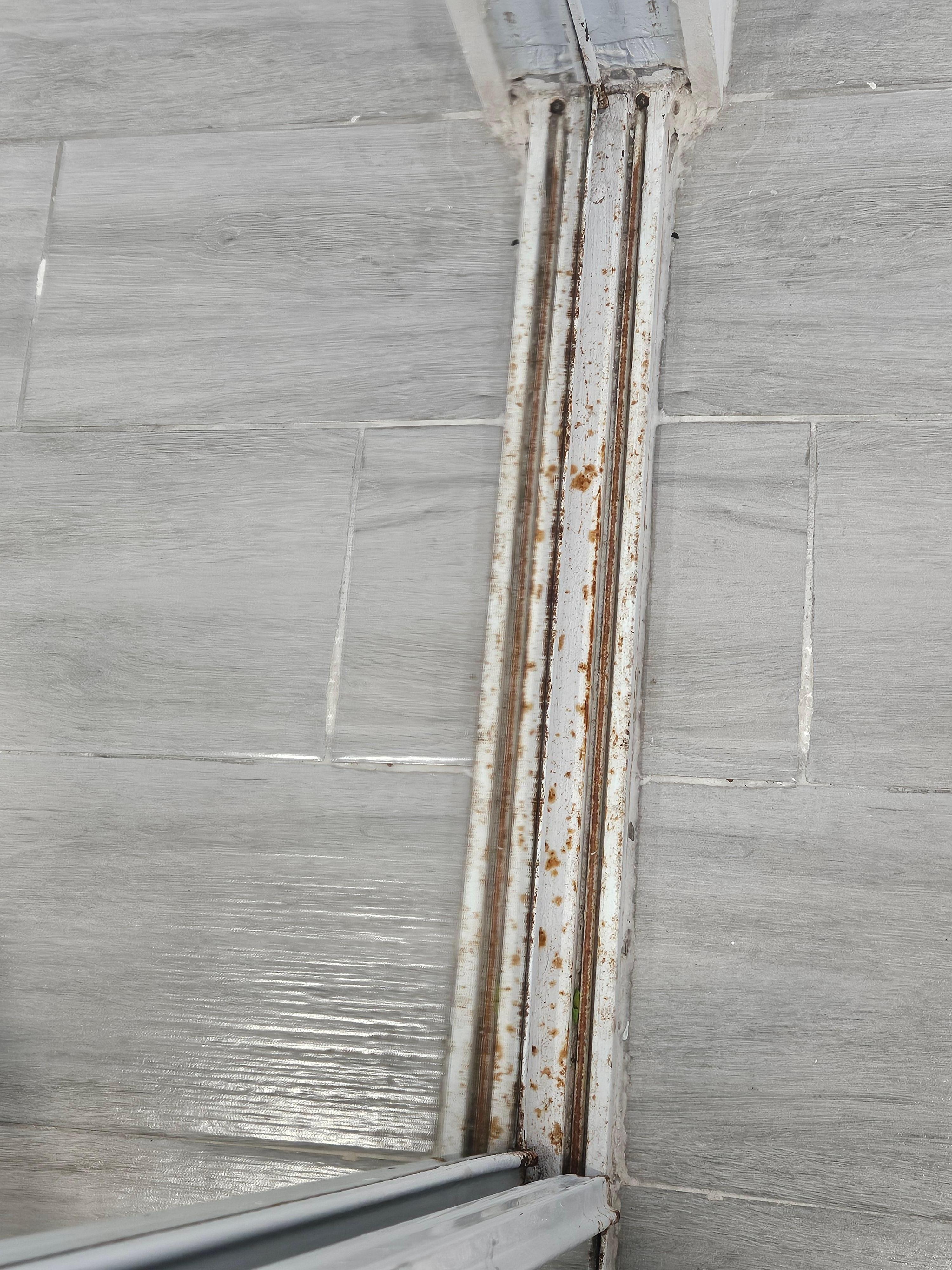 Completely  rusted metal around door.